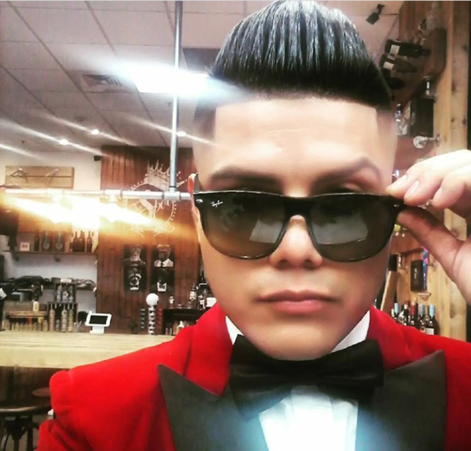 Founder in red suit barber shop